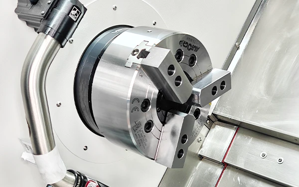 Chuck and workholding arrangement inside a CNC turning center